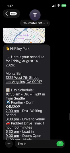 The morning text for August 14 as it arrived on a phone: the venue address, then the day schedule starting with the drummer's flight in from Seattle.
